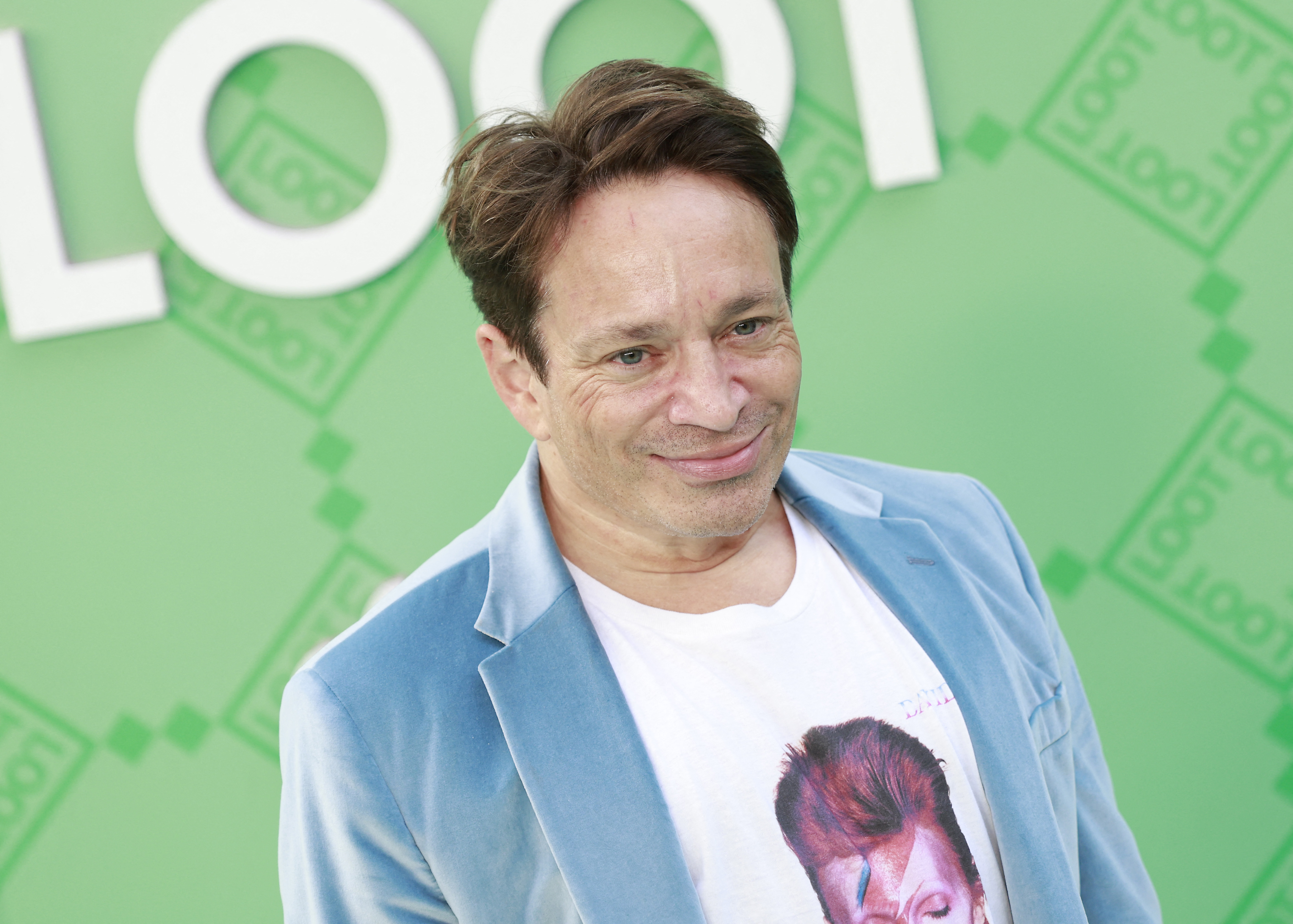 Chris Kattan, who didn't know his name was mentioned in Jordan Peele's 'Nope,' smiles at an event