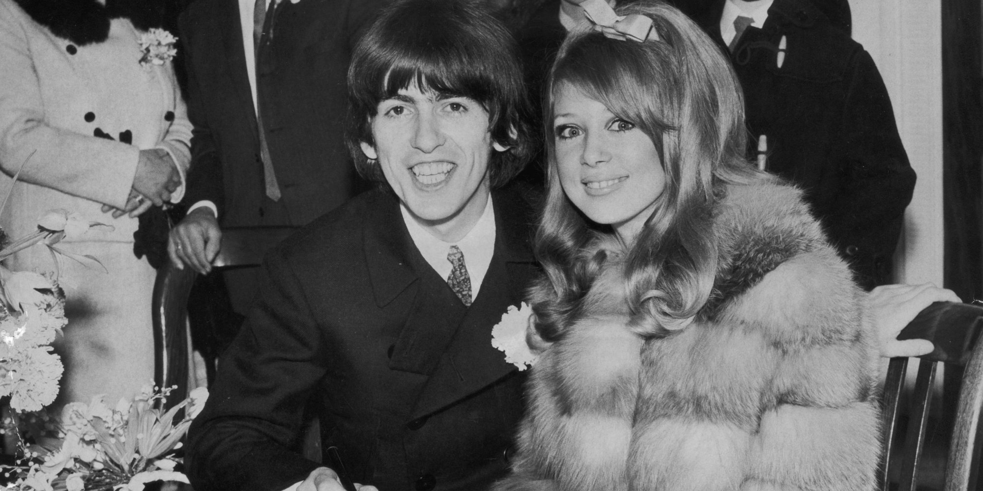 George Harrison and Pattie Boyd sign the registrar book after their Jan. 1966 wedding ceremony.