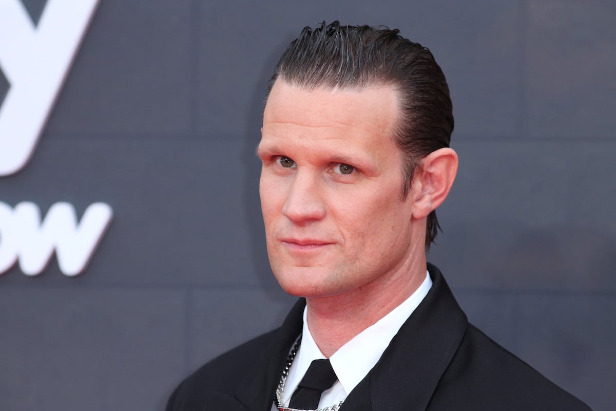 headshot of House of the Dragon's Matt Smith in a suit and tie looking serious