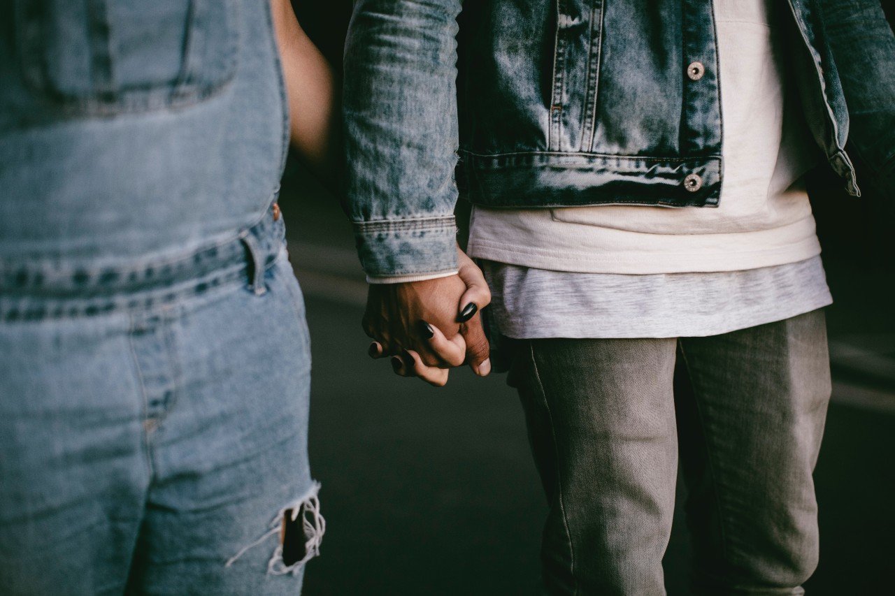 Couple holding hands