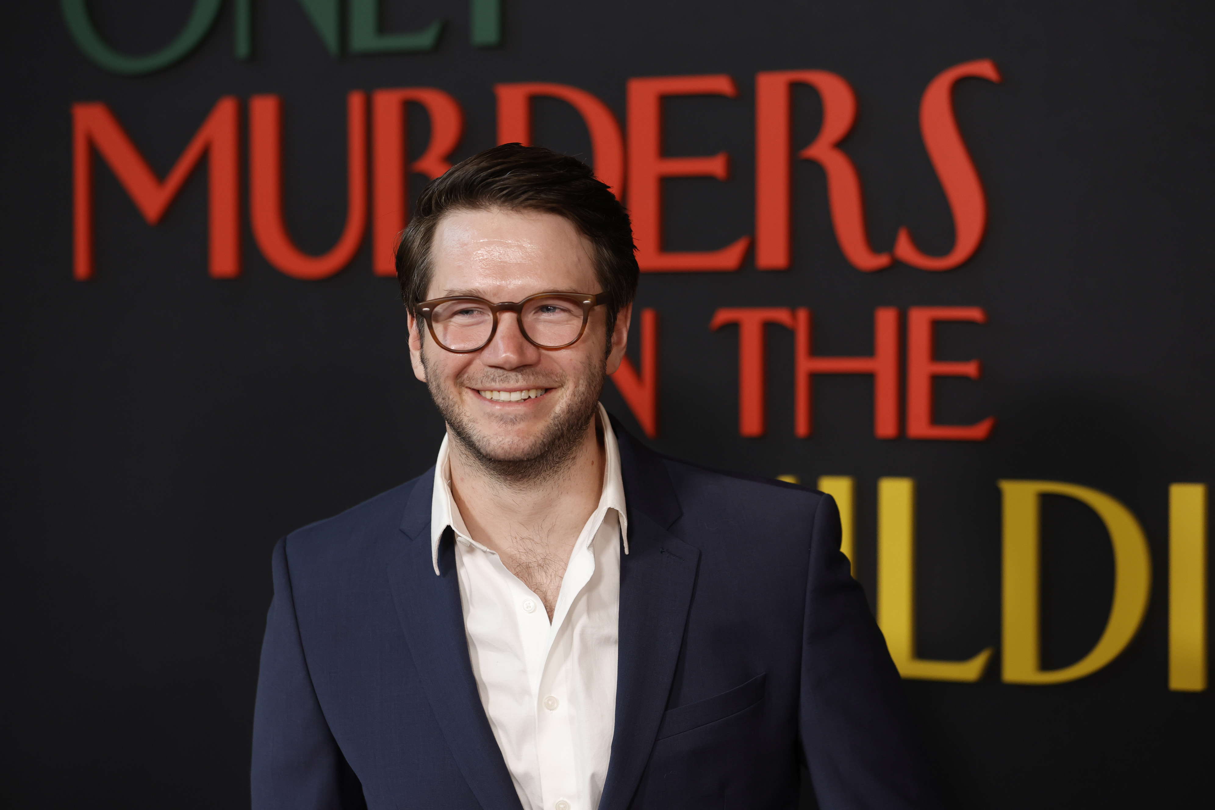 James Caverly, who plays Theo Dimas, smiles at the premiere of 'Only Murders in the Building' Season 2