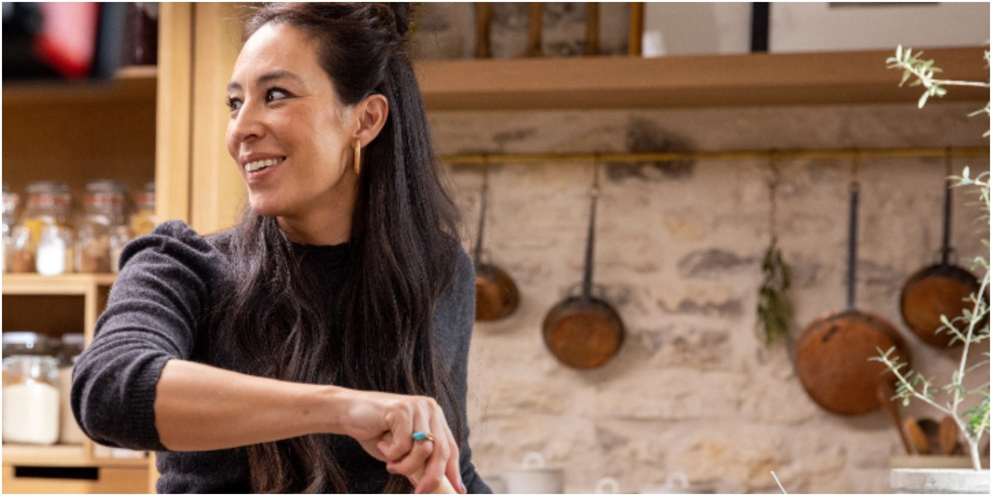 Joanna Gaines cooks in the kitchen of her discovery+ show.