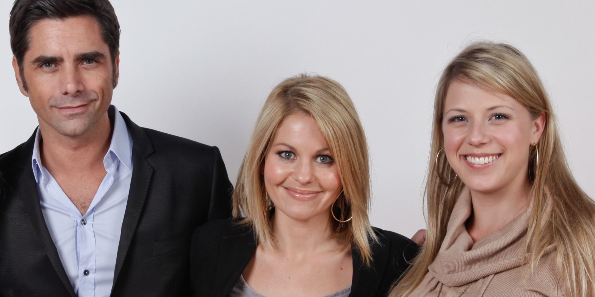 'Fuller House' co-star John Stamos, Candance Cameron Bure and Jodie Sweetin pose for a photograph.