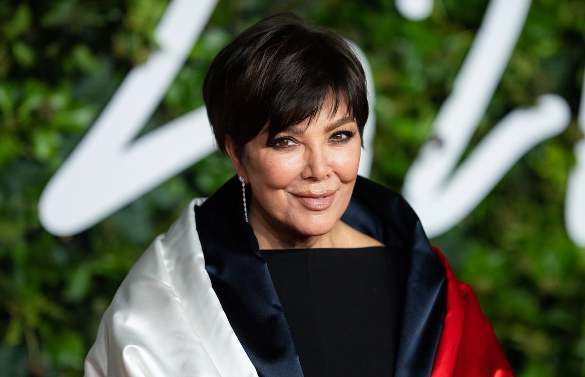 MasterClass instructor Kris Jenner posing in a black, red, and white outfit