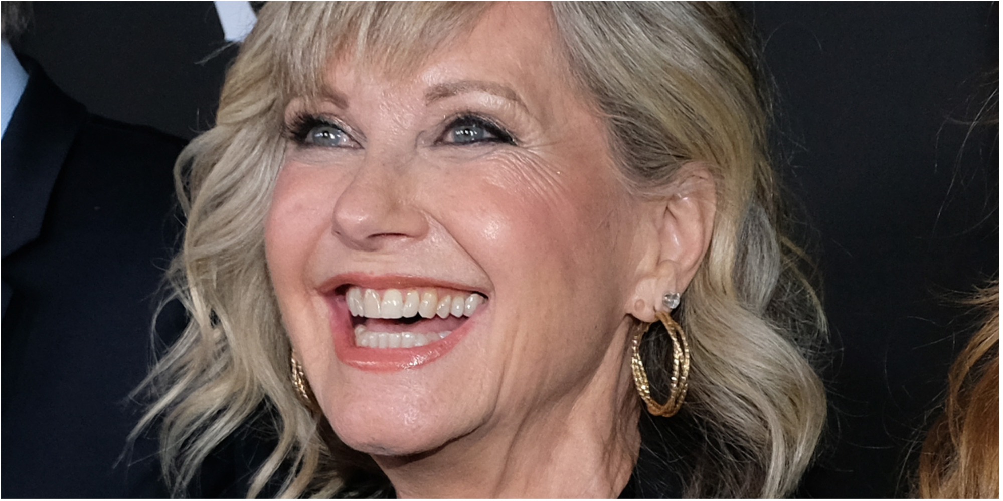 Olivia Newton-John smiles for the cameras a G-Day USA in Jan. 2020.