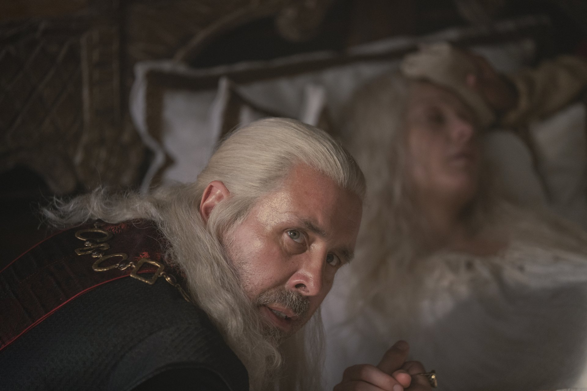 Viserys (Paddy Considine) at Queen Aemma (Sian Brooke) in the 'House of the Dragon' premiere episode