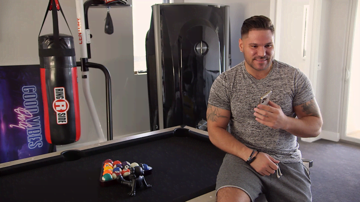 Ronnie Ortiz-Magro sits on a pool table in 'The Meatball Show' episode of 'Jersey Shore: Family Vacation'