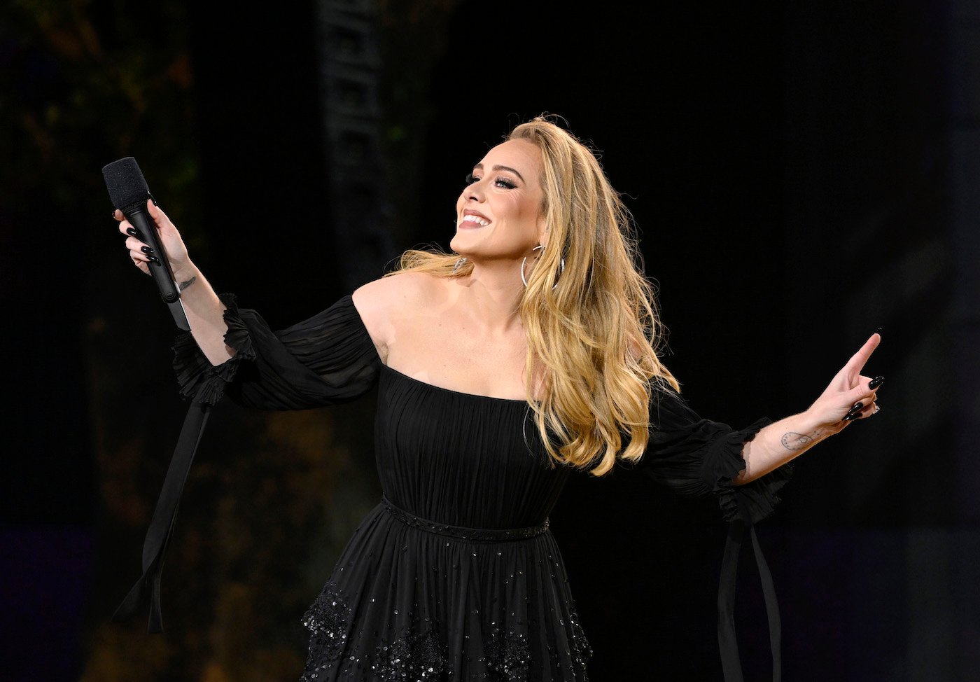 Adele, who is one award away from an EGOT, performing in black.
