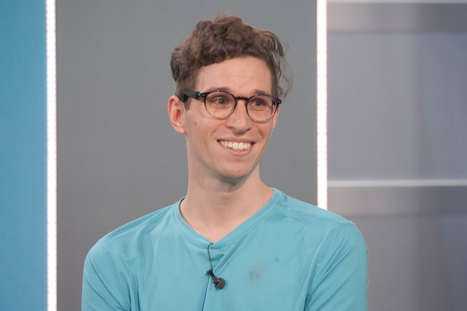 Michael Bruner, who starred in 'Big Brother 24' on CBS, wears a light blue shirt and glasses.