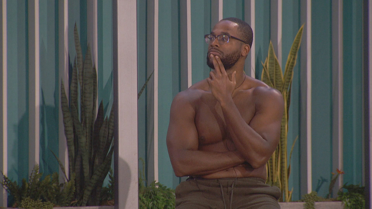 Monte Taylor sits outside shirtless with his fingers on his chin on 'Big Brother 24'.