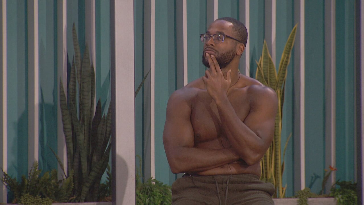 Monte Taylor sits outside shirtless with his fingers on his chin on 'Big Brother 24'.