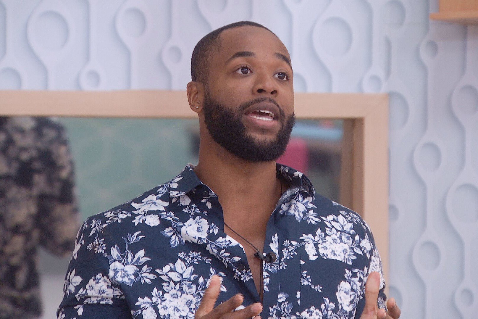 Monte Taylor, who was the runner-up of 'Big Brother 24' on CBS, wears a dark blue floral button-up shirt.