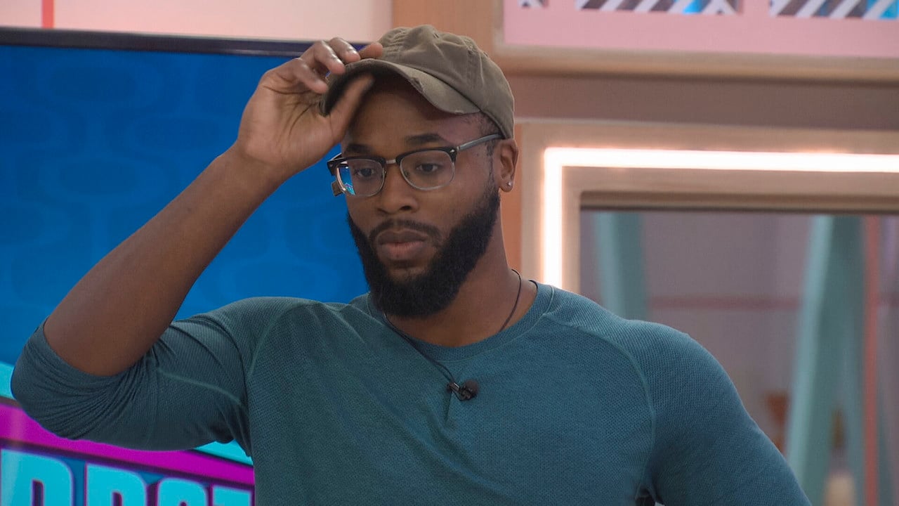 Monte Taylor looks worried as he lifts his hat on 'Big Brother 24'.