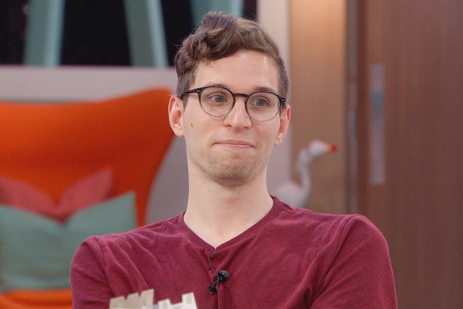 Michael Bruner, who is in danger of leaving during the 'Big Brother 24' double eviction, wears a maroon shirt and glasses.
