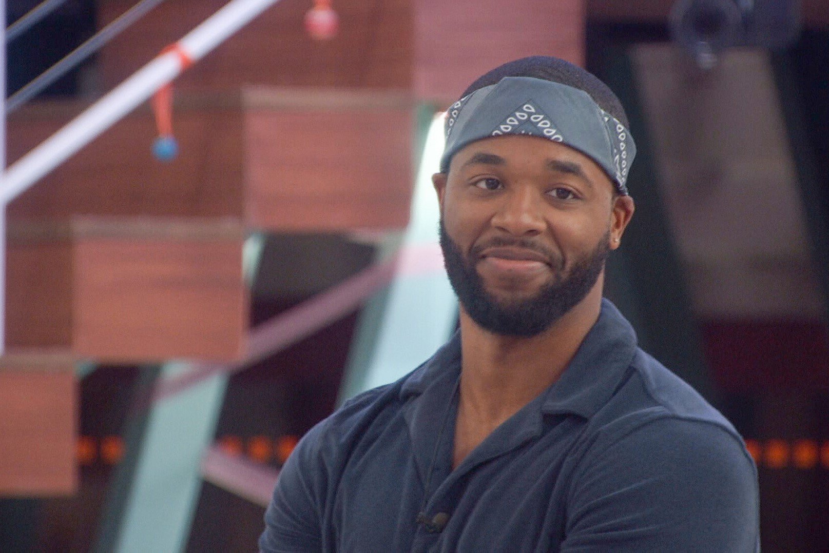 Monte Taylor, who cast the sole vote to evict in 'Big Brother 24' Episode 33, wears a dark blue polo shirt and dark gray bandana.