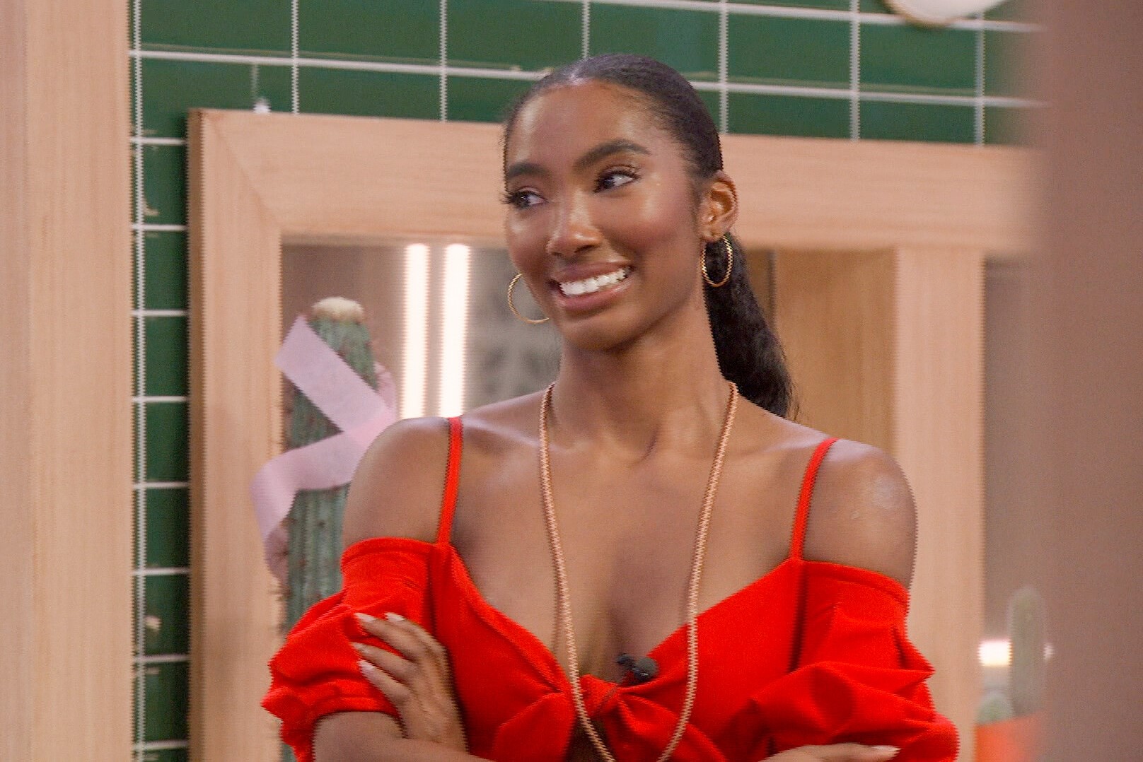 Taylor Hale, who, according to 'Big Brother 24' spoilers, made the final three, wears a red dress and the HOH key around her neck.