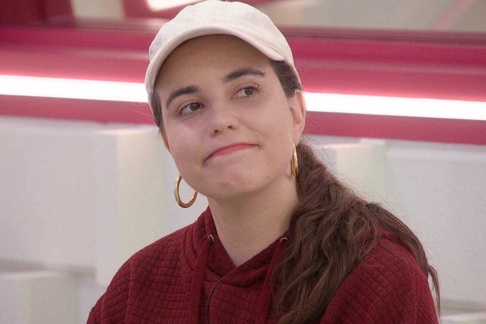 Brittany Hoopes, who won the 'Big Brother 24' Power of Veto during week 10, wears a maroon hoodie and white baseball cap.