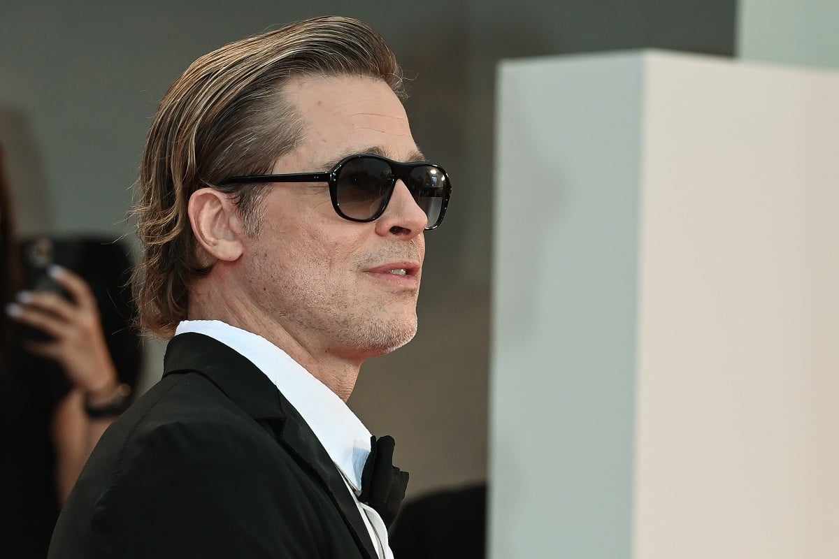 Brad Pitt smirking at the International Venice Film Festival.