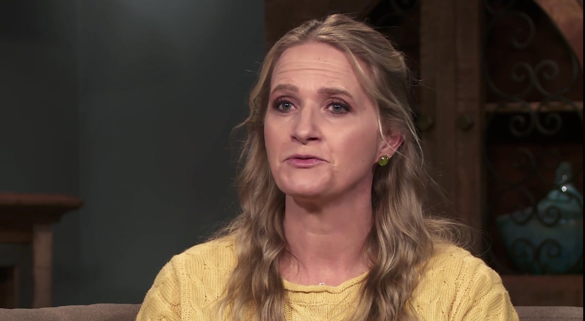 Christine Brown wearing a yellow shirt while in a confessional for 'Sister Wives' Season 17 on TLC.