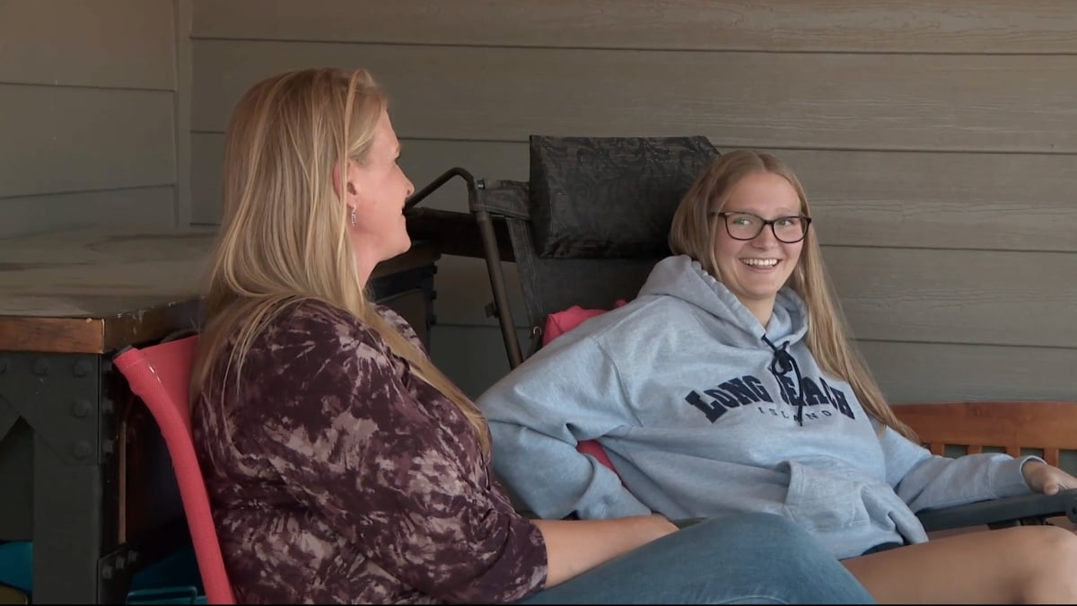 Christine Brown and Ysabel Brown sitting together outside on 'Sister Wives' Season 16 on TLC.