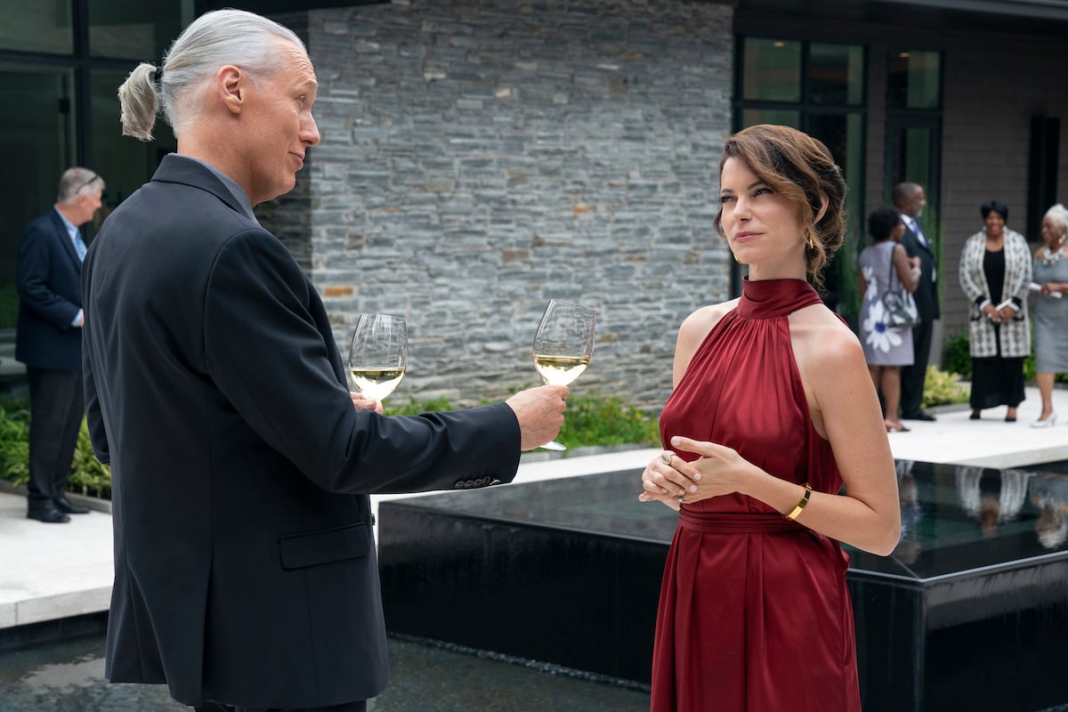 'Cobra Kai' Season 5: Terry Silver (Thomas Ian Griffith) offers Amanda LaRusso (Courtney Henggeler) a glass of wine