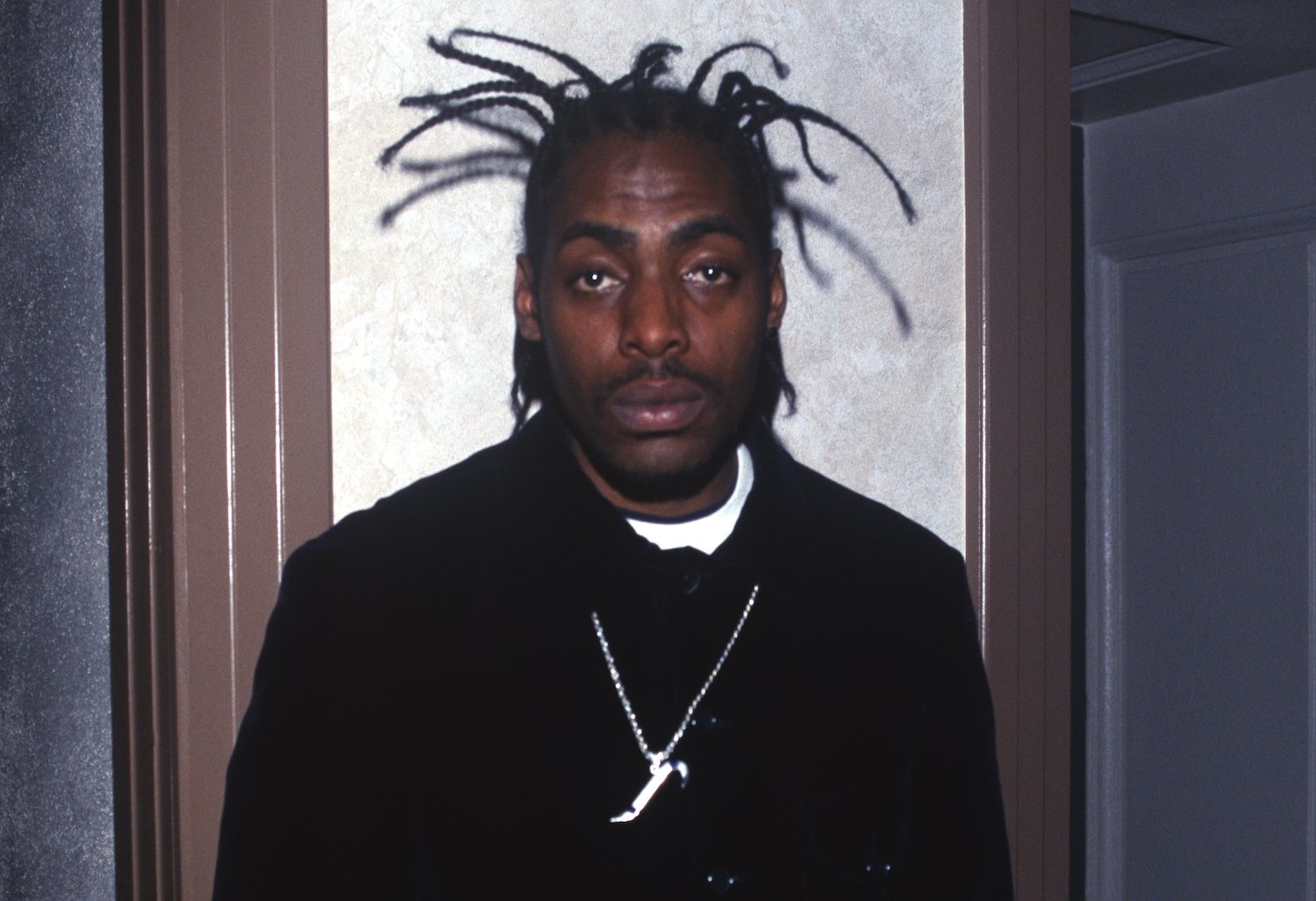 A head shot of Coolio against a neutral background. Coolio had 10 children and one ex-wife.