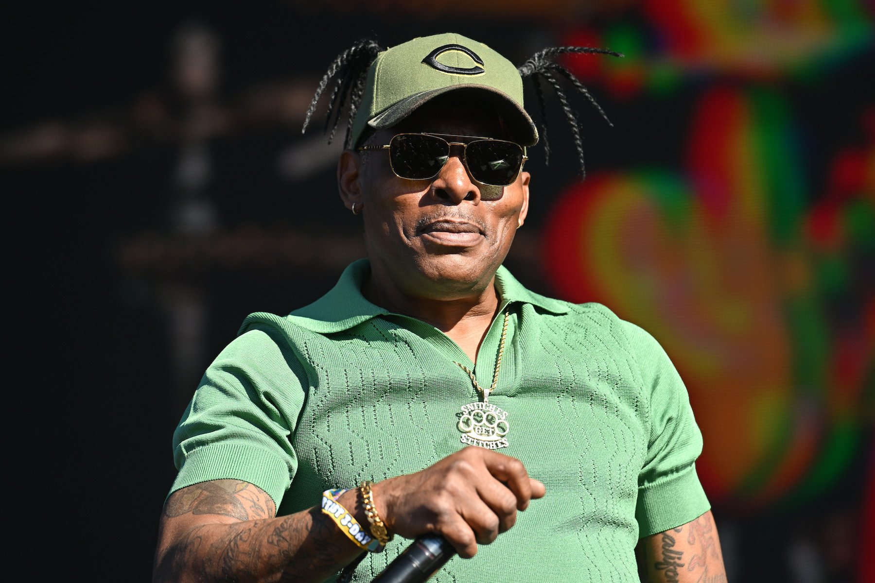 Coolio, seen here wearing green, who did the theme song for a beloved Nickelodeon show