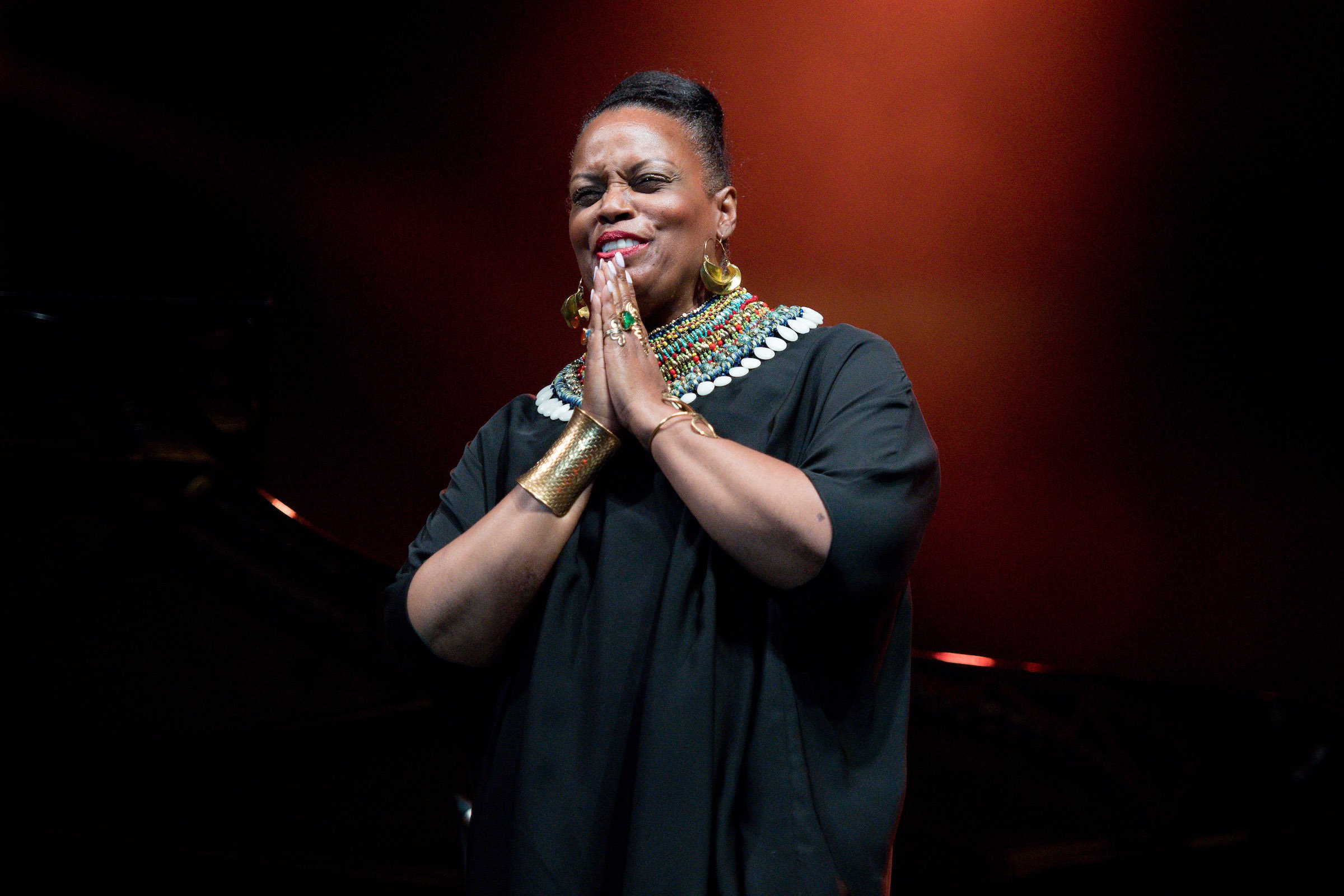 Dianne Reeves, whose music Sheryl Lee Ralph sang at the 2022 Emmys, on stage wearing black.