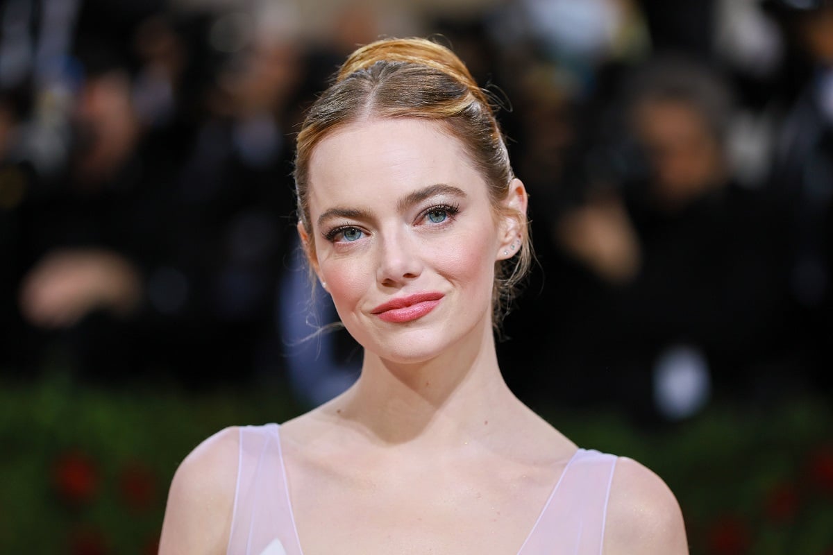 Emma Stone smirking while at the Met Gala.