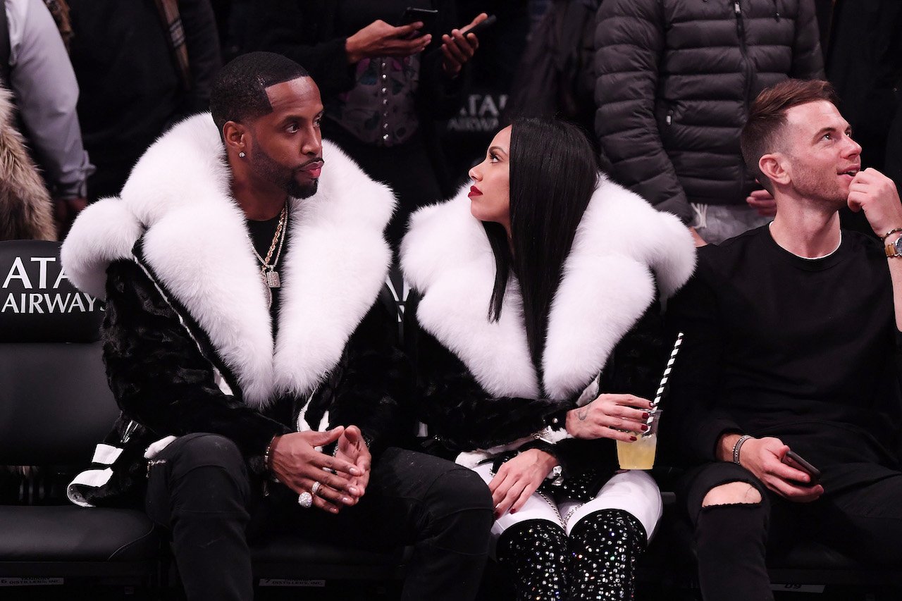 Erica Mena and Safaree Samuels sit courtside at basketball game; their divorce settlement has been finalized