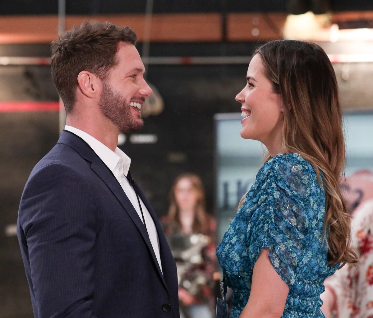 'General Hospital' star Johnny Wactor in a blue suit, and Sofia Mattsson in a blue floral dress in a scene from the soap opera.