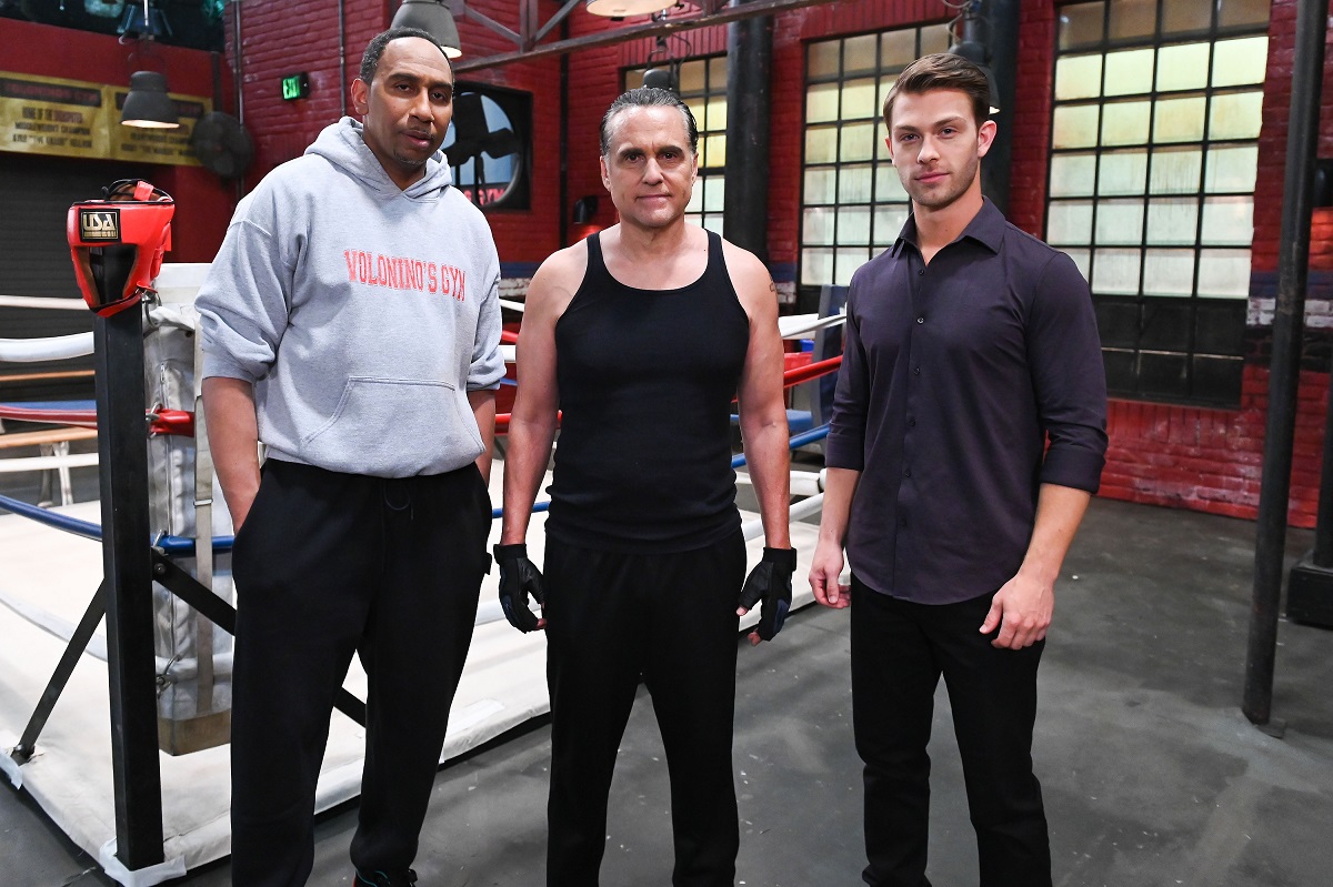 ESPN reporter Stephen A. Smith with 'General Hospital' stars Maurice Benard and Evan Hofer pose outside a boxing ring.