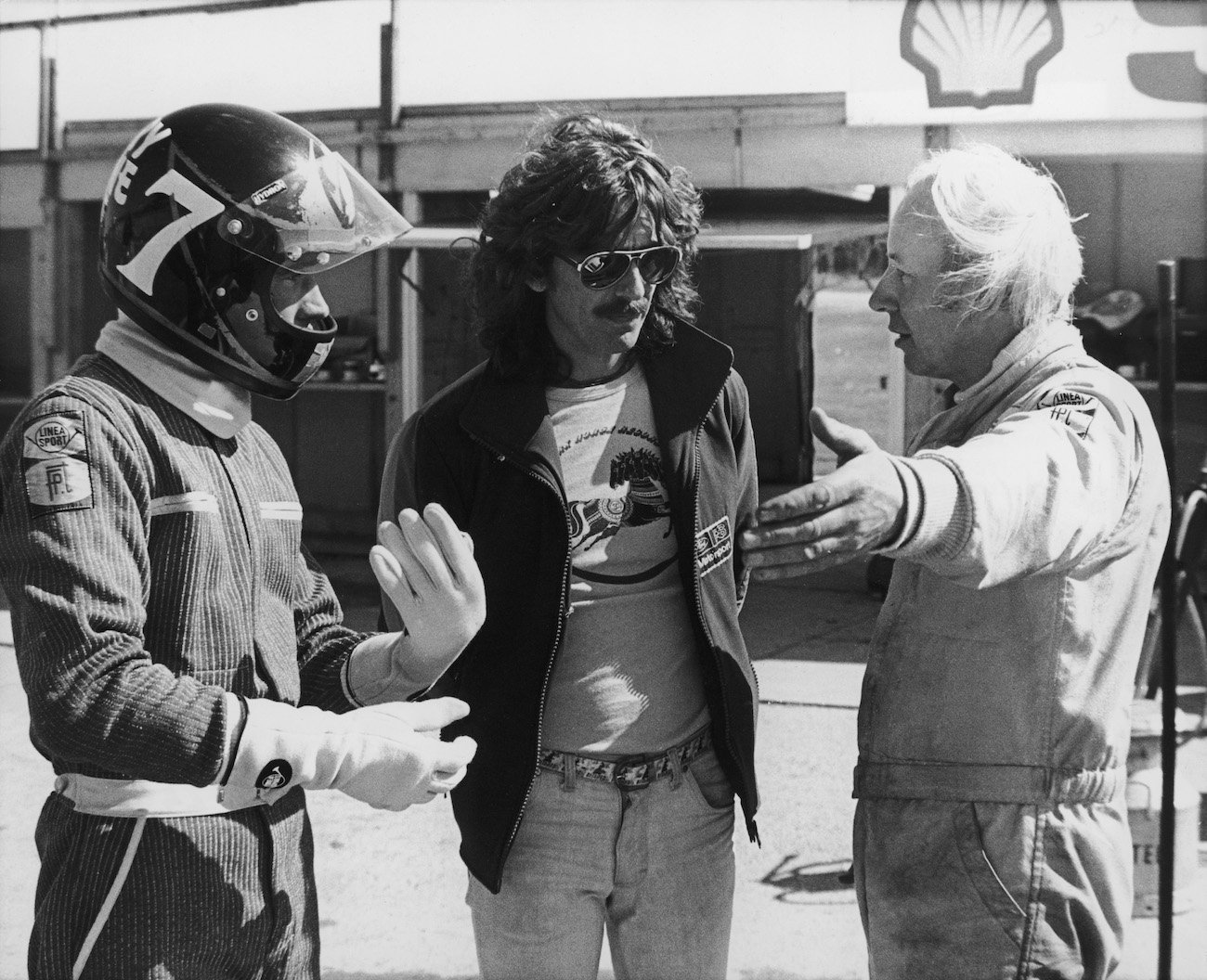 George Harrison with Barry Sheene at Brands Hatch, where he was driving a Formula One race car for the first time.