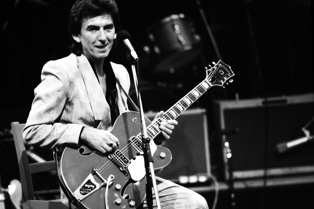 George Harrison on stage with Carl Perkins in 1985.