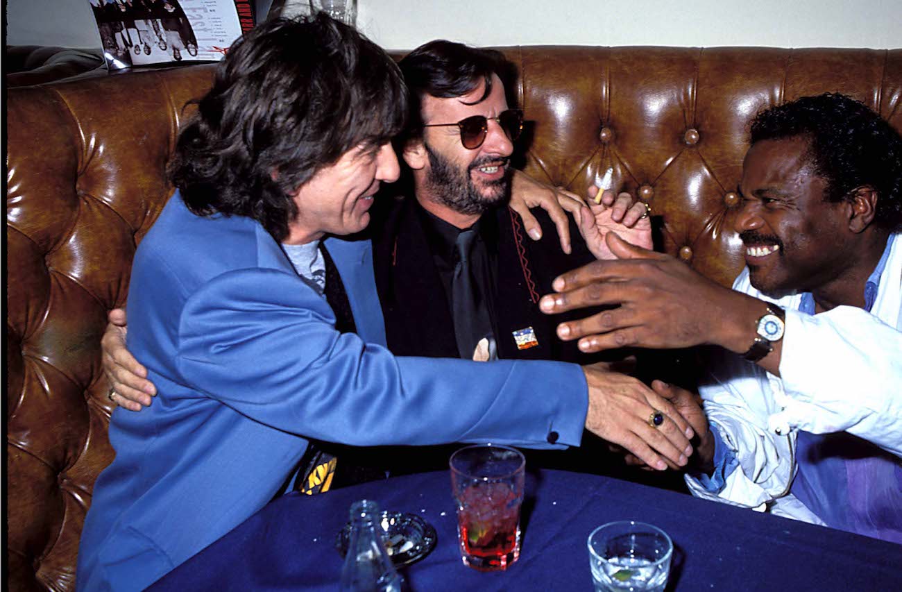 George Harrison, Ringo Starr, and Billy Preston out at a club in 1990.