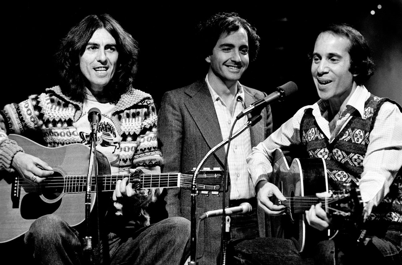 George Harrison with 'SNL' creator, Lorne Michaels and musician, Paul Simon in 1976.