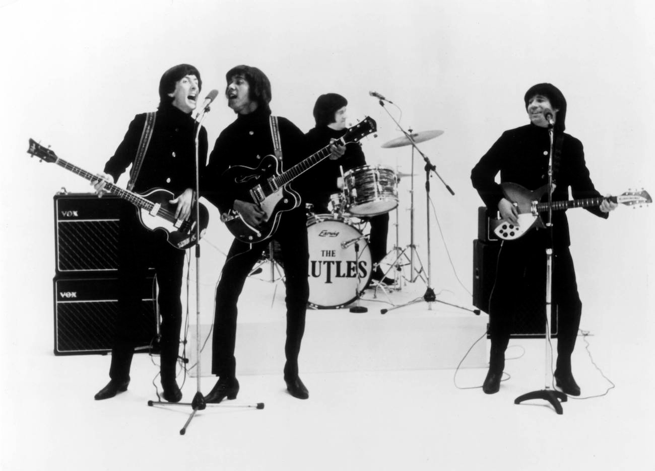 The Rutles performing in black.