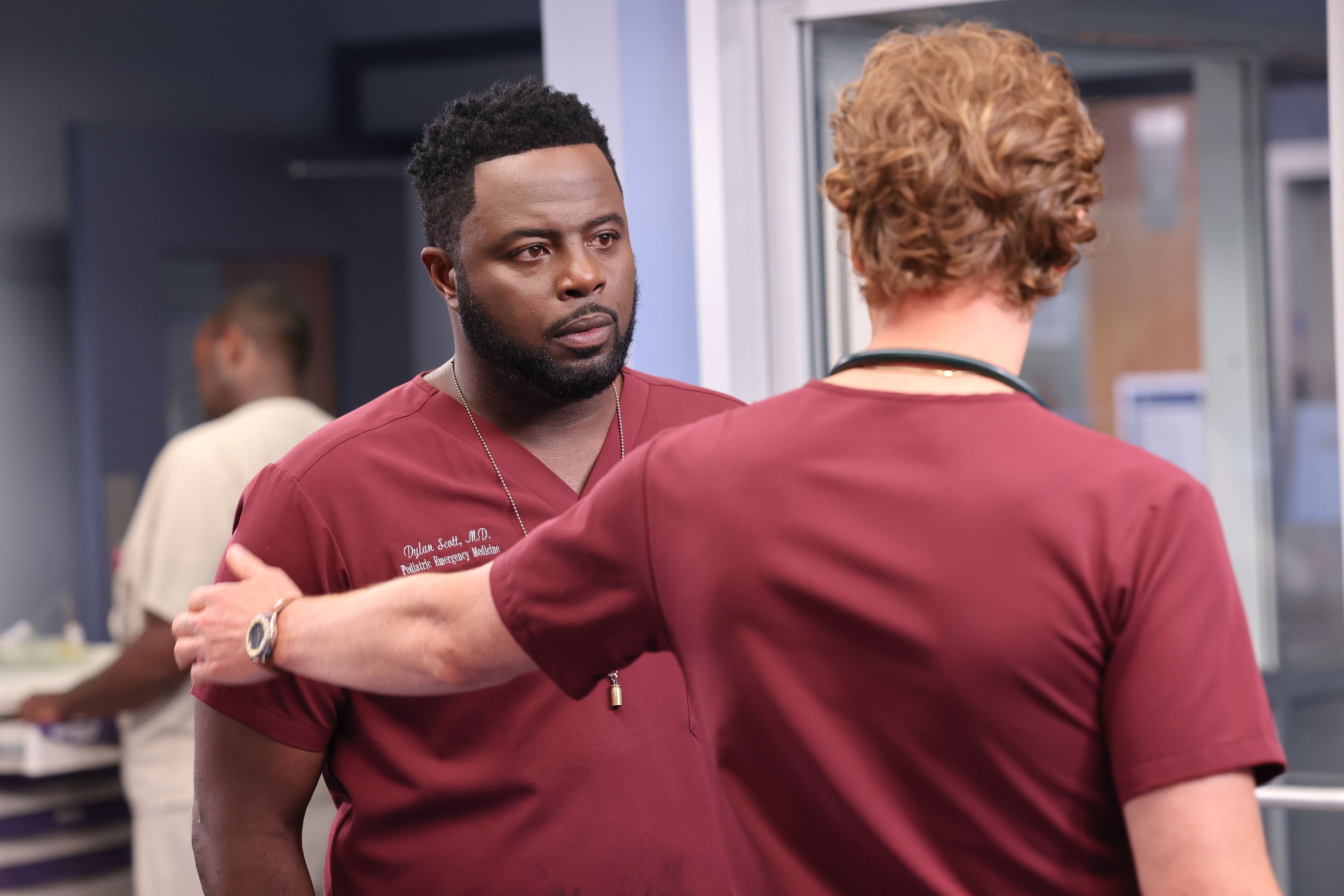 Will comforting Dr Scott (Guy Lockard) in the 'Chicago Med' Season 8 premiere