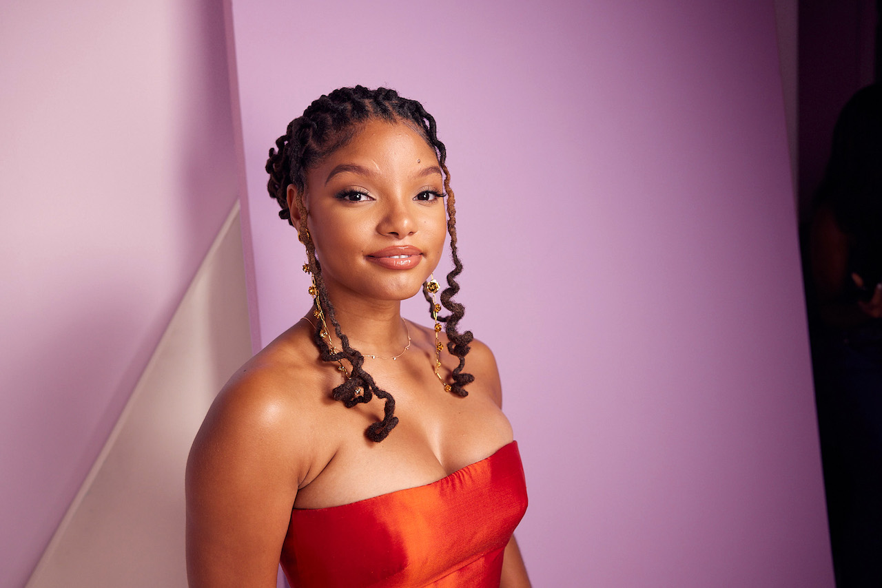 Halle Bailey smiles for photo during 'The Little Mermaid' event; Bailey has been under criticism for casting