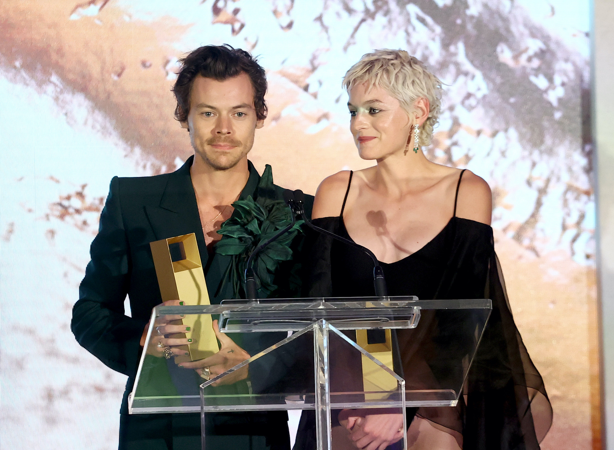 Harry Styles nd Emma Corrin accept the TIFF Tribute award for performance for My Policeman