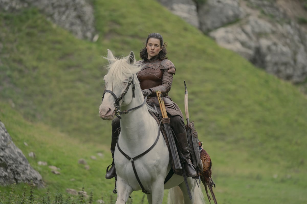 Rachel Redford as Lady Rhea in House of the Dragon. Rhea rides a white horse through the Vale.