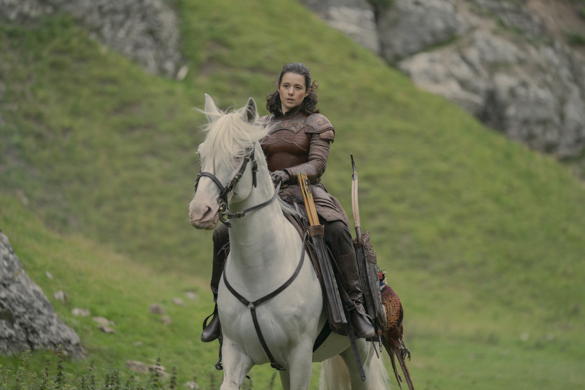 Rachel Redford as Lady Rhea in House of the Dragon. Rhea rides a white horse through the Vale. 