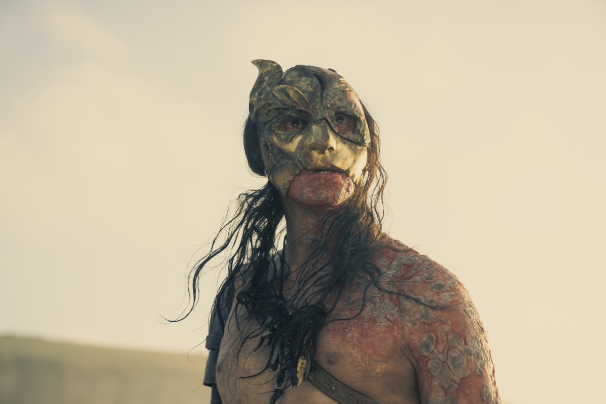 Daniel Scott-Smith as the Crabfeeder in House of the Dragon. The Crabfeeder wears a mask and no shirt.