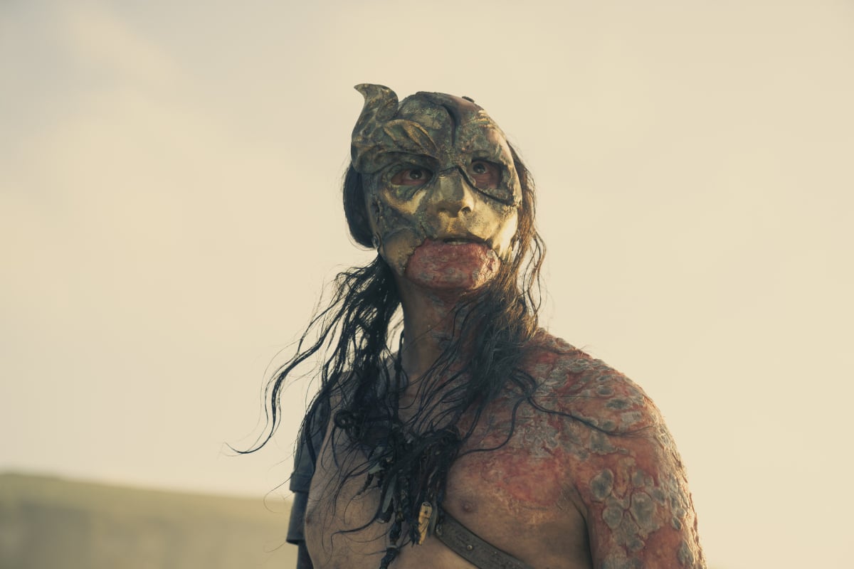 Daniel Scott-Smith as the Crabfeeder in House of the Dragon. The Crabfeeder wears a mask and no shirt. 