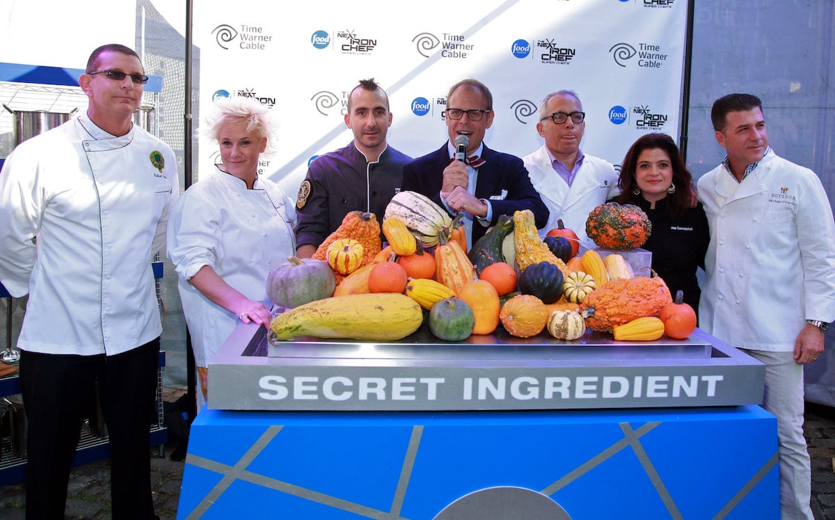 Chefs Robert Irvine, Anne Burrell, Marc Forgione, host/judge Alton Brown, chefs Geoffrey Zakarian, Alex Guarnaschelli, and Michael Chiarello attend a "Next Iron Chef" event in 2011