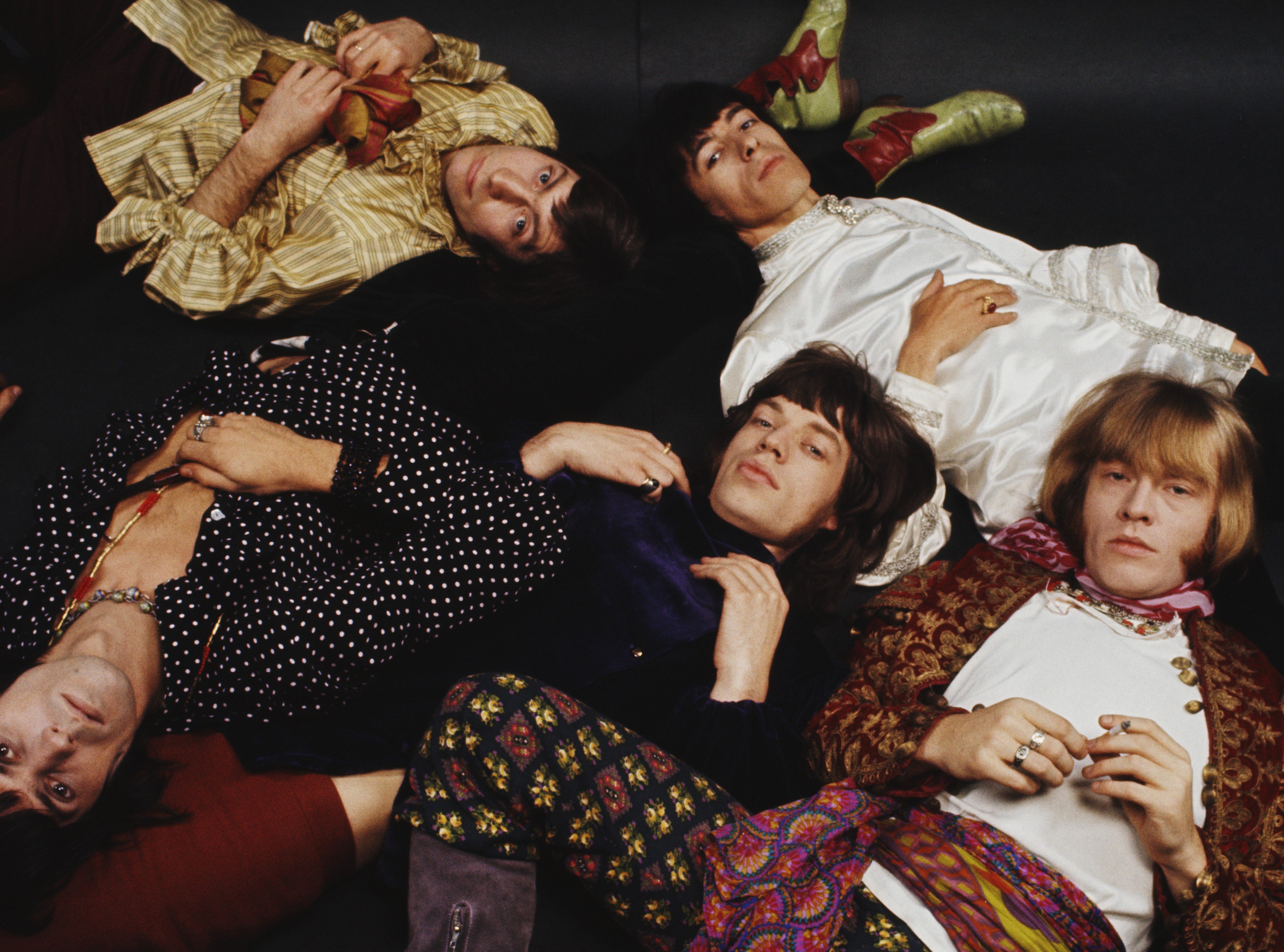 The Rolling Stones lying on the floor