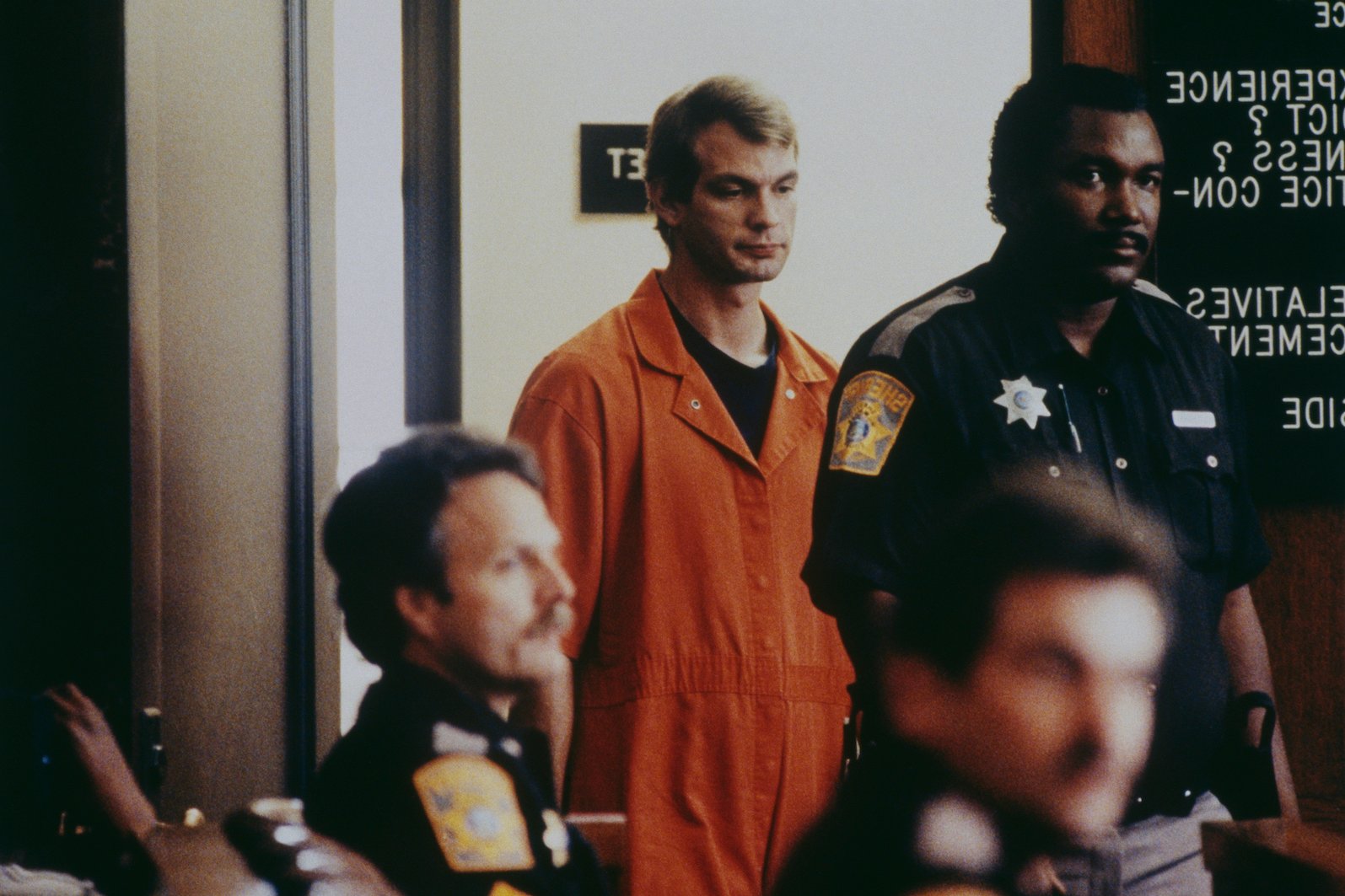 Jeffrey Dahmer in an orange jumpsuit at his trial
