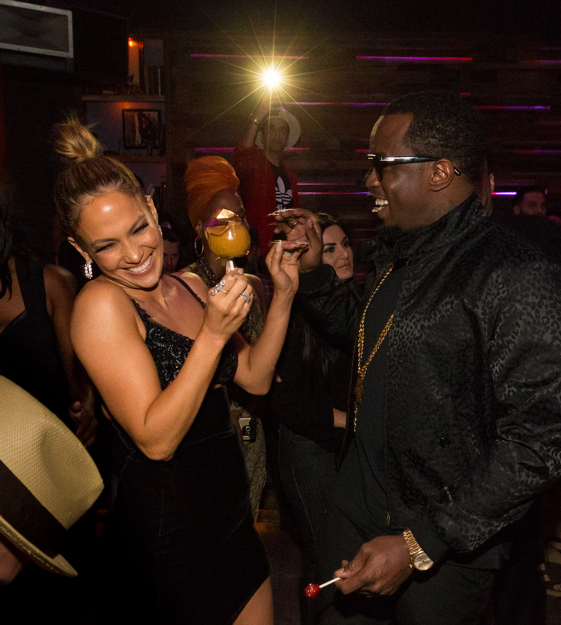 Jennifer Lopez and Diddy laugh at party together; Diddy may have inspired Lopez's wedding guest attire