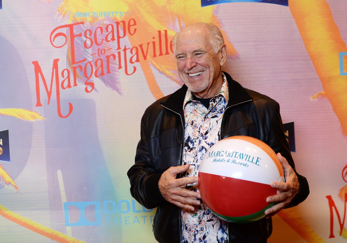 Musician Jimmy Buffett holds a beach ball at "Escape To Margaritaville" LA premiere