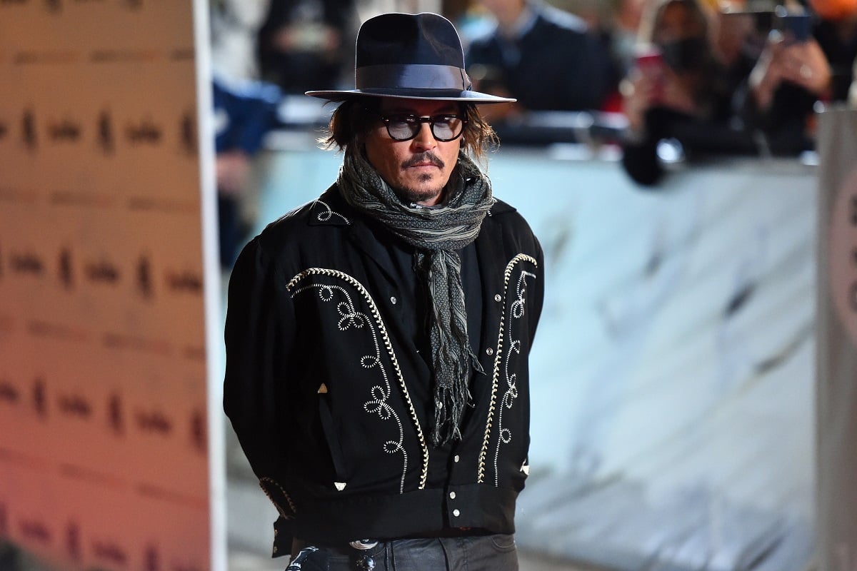 Johnny Depp posing at Rome Film Fest.